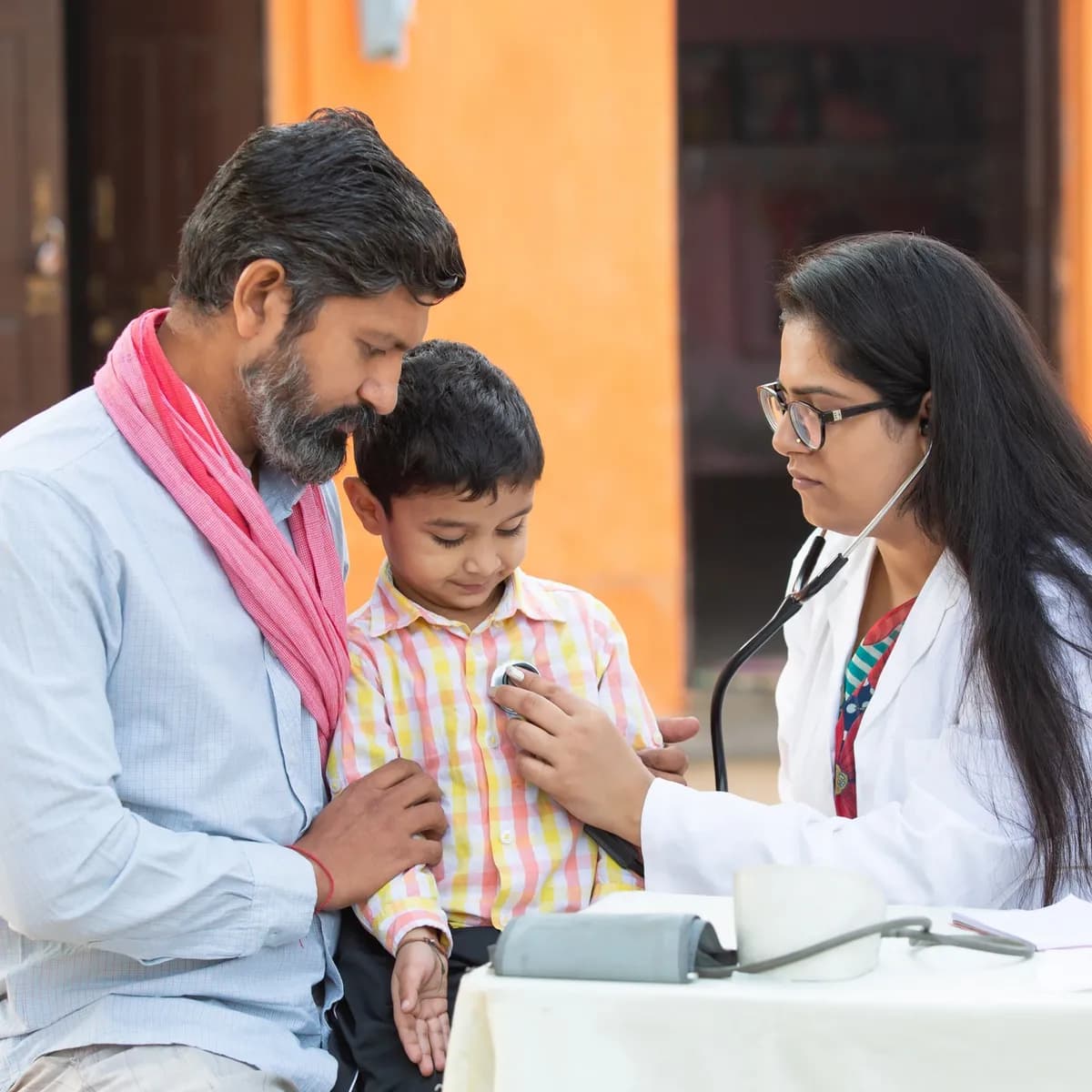 Five men in an office exchanging documents, one in police uniform